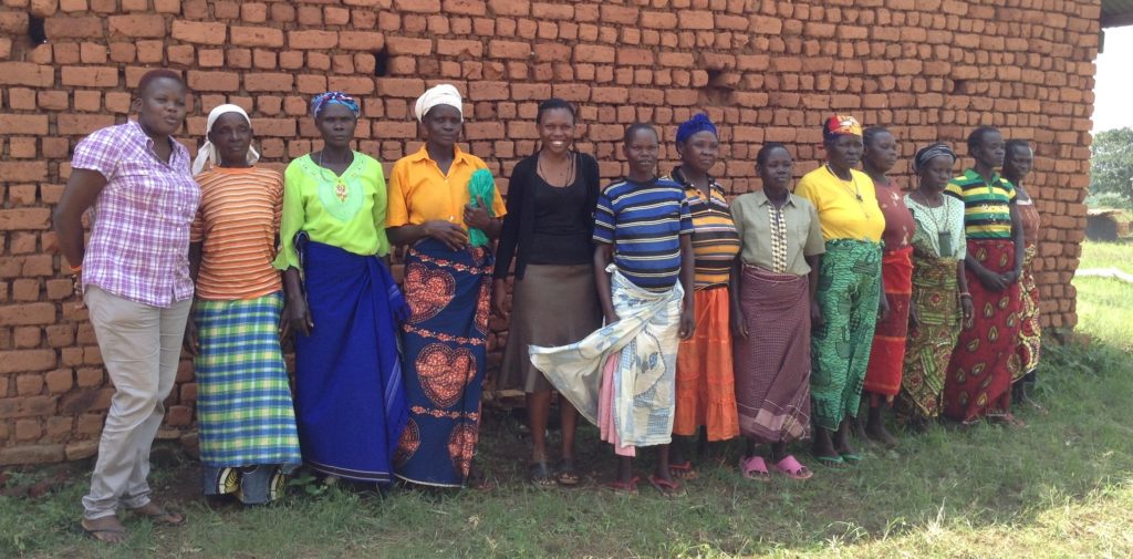 Cornell PhD student Paula Iragaba (fifth from the left) and her colleague, Winifred Candiru (first from the left), together with adult women cassava farmers after a focus group discussion in the Arua district.